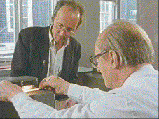 Tim looks on at a paper punch card reader