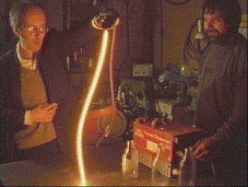 An arc welder rod illuminates the workshop